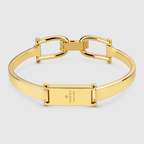 Stirrup motif bangle bracelet - gold-toned brass